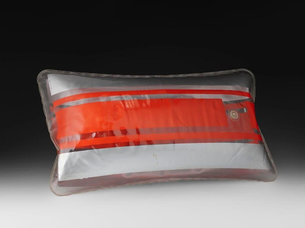 Orange and silver striped inflatable PVC pillow (1967)